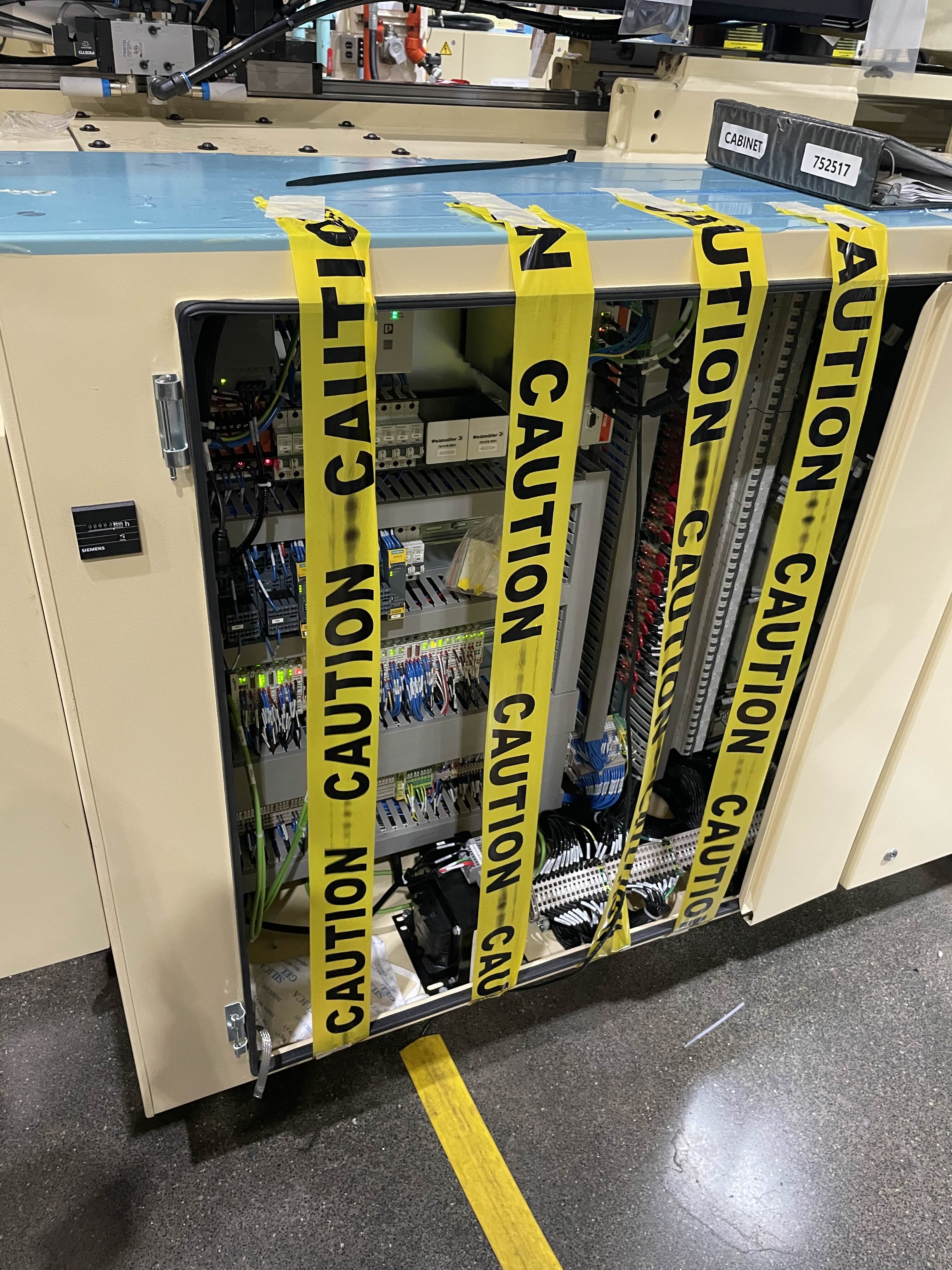 Image of large industrial machinery on a manufacturing floor.